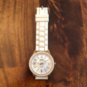 Rose gold XOXO watch with rhinestone bevel face and silicone cream band